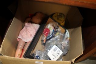 A box containing various toys, including puppets,