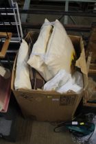 A box containing various pillows; cushions; duvets