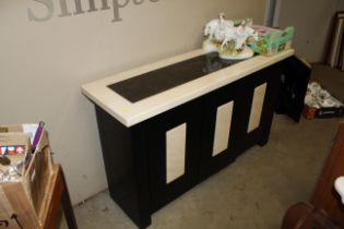 A marble topped side cabinet