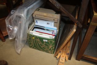 An artists traveling easel, paint box and various