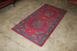 An approx. 6' x 3'1" Turkish patterned rug AF