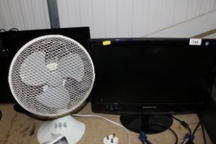 A small Samsung computer monitor and an electric t