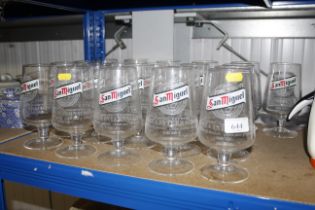 Twenty-one San Miguel glasses