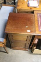 An Edwardian mahogany bedside cupboard