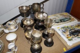 A collection of plated trophy cups