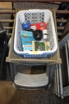 A plastic two tier step; a wooden trug basket and