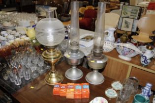 Three oil lamps and accessories