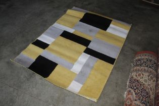 An approx. 5'9" x 4' modern rug