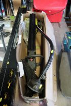 A Ryobi RLT26HT petrol line trimmer with original