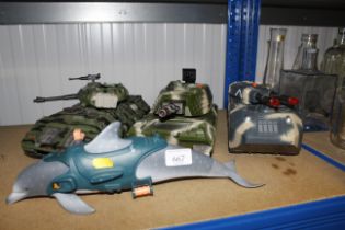 Three model toy tanks and an Action Man dolphin