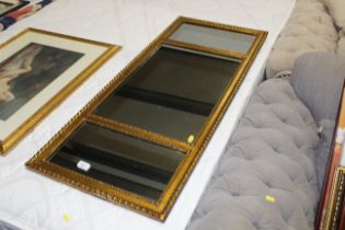 A gilt framed triple overmantel mirror