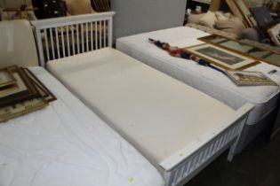 A single bed with memory foam mattress and railed