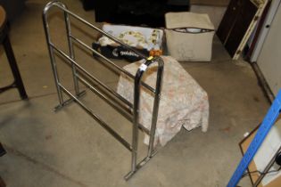 A metal towel rail and foot stool