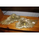 A pair of gilt angel wing decorations