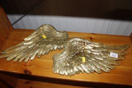 A pair of gilt angel wing decorations