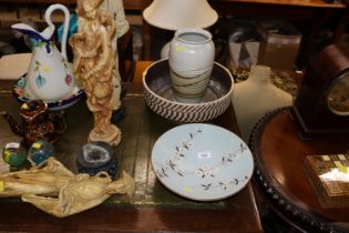 A pottery glazed pedestal bowl with floral decoration x mark to base; a Studio pottery ribbed vase