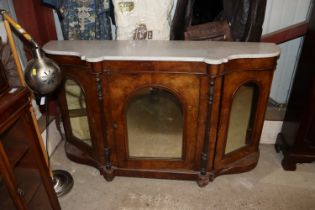 A Victorian walnut credenza surmounted by a white