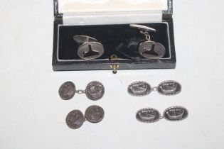 Three pairs of silver cuff-links