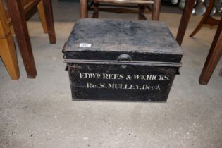 A metal deeds box lacking key