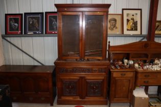 A Victorian carved walnut secretaire bookcase