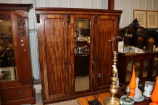 A Victorian mahogany triple wardrobe