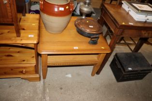 An oak coffee table with fitted under tray