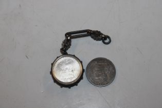 Two 1826 shilling coins, one in glass with silver