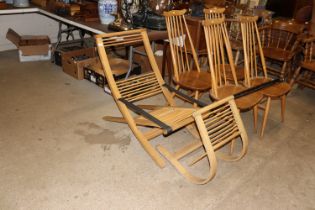 A rattan and steam bent ash lounge chair and an ottoman, by the well known Welsh designer David