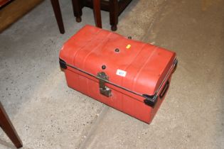 A red painted metal storage box of small proportio