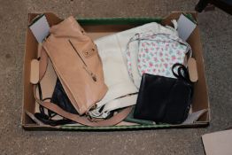 A box containing six leather handbags