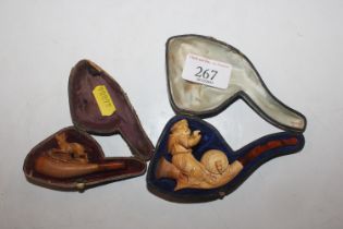 A Meerschaum pipe in the form of a monk and one ot