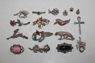 A box of decorative costume brooches to include on