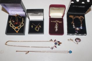 A box containing various necklaces ear-rings and n