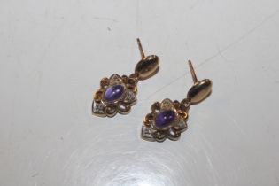 A pair of 9ct gold amethyst and diamond set ear-ri