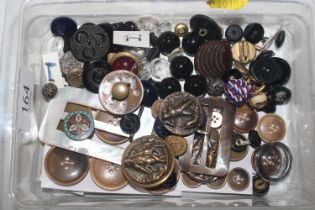 A box of assorted buttons, buckles and studs