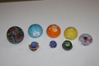 Eight glass paperweights