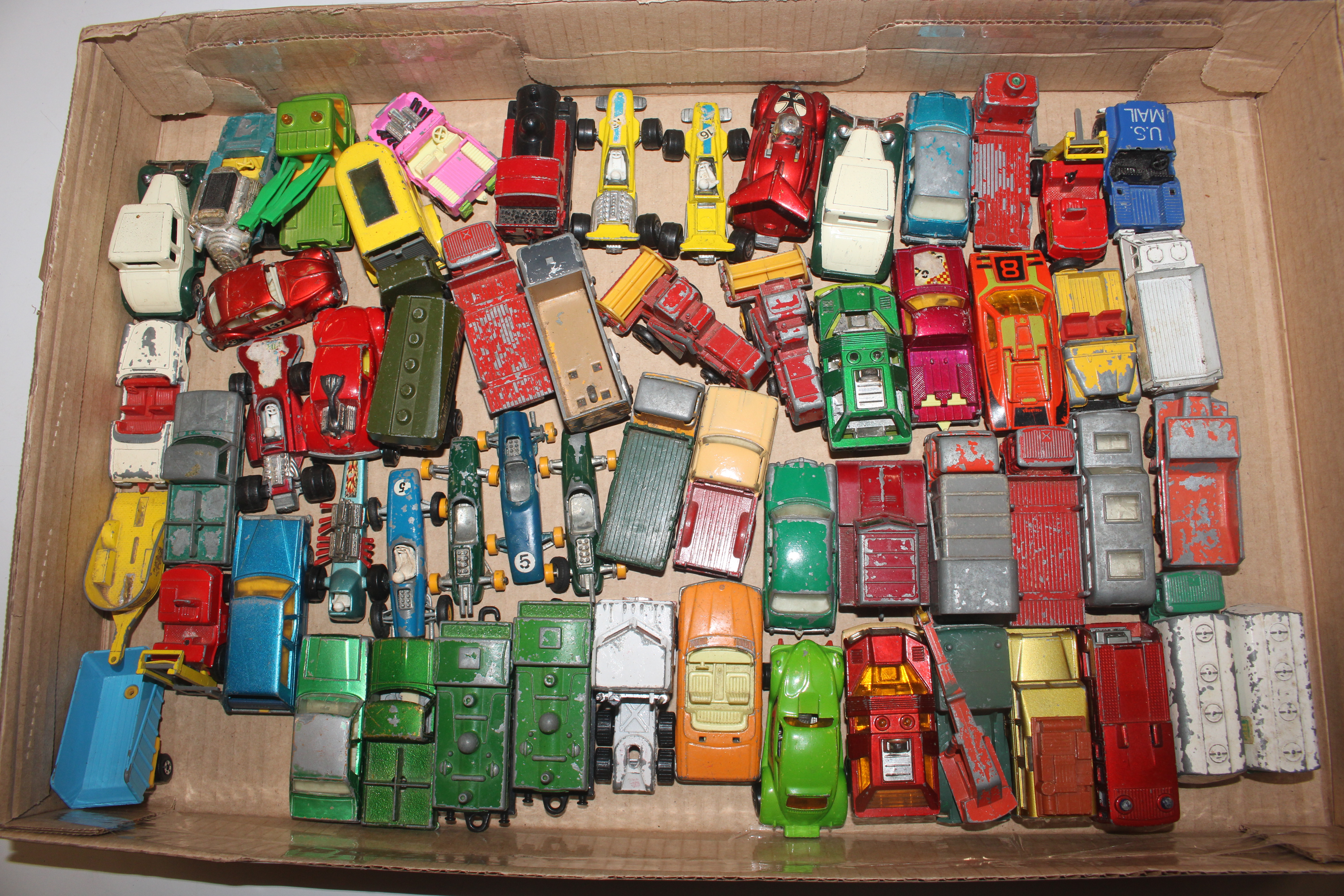 A box of Matchbox die-cast vehicles