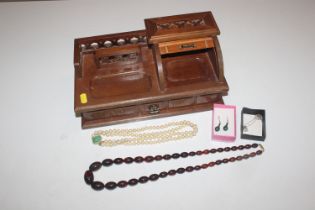 A wooden desk top jewellery box and contents of va