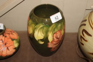 A Moorcroft Pottery "Hibiscus" pattern vase signed W. M. to base