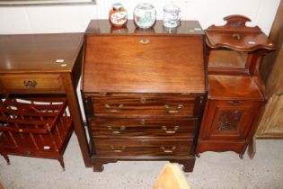 A mahogany bureau of small proportions fitted thre