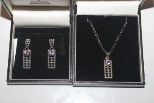 A Macintosh inspired 925 silver pendant set with a