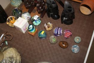 Fourteen various glass paperweights