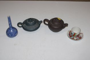 Two Oriental teapots with character mark to base;