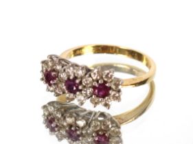 An 18ct gold diamond and ruby set ring, ring size