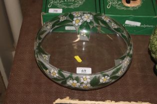 A clear glass bowl with painted decoration of flow