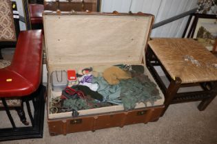 A wooden and leather bound trunk with contents of