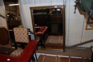 A gilt framed and bevel edged wall mirror