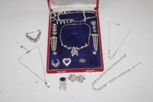 A box containing various paste set jewellery inclu