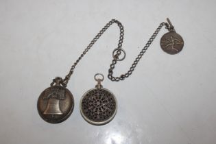 A pocket watch decorated with an eagle hung to whi