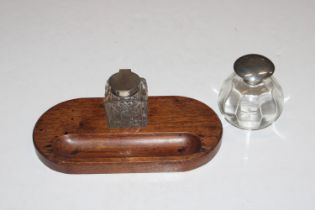 A square cut glass and silver mounted inkwell on w